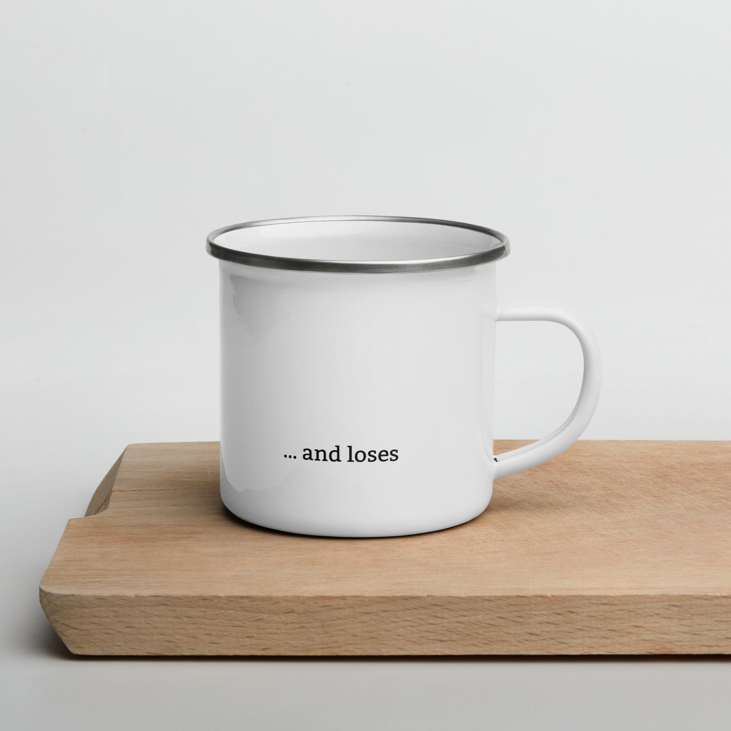 Minimalist enamel mug with golf hole and red flag on one side with “precision meets personality” text, and “…and loses” on the reverse