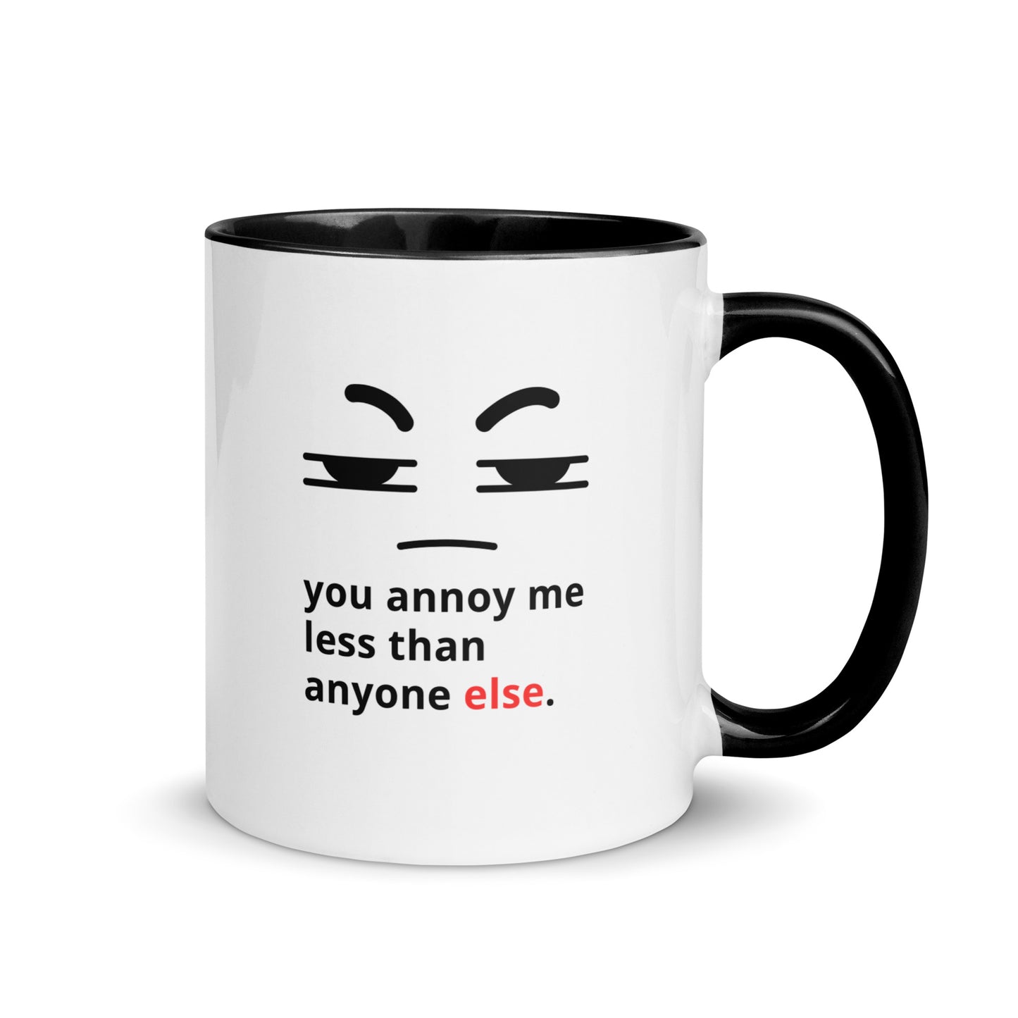 Snarky relationship mug with “You Annoy Me Less Than Anyone Else” text and frowning face design black handle and inside 