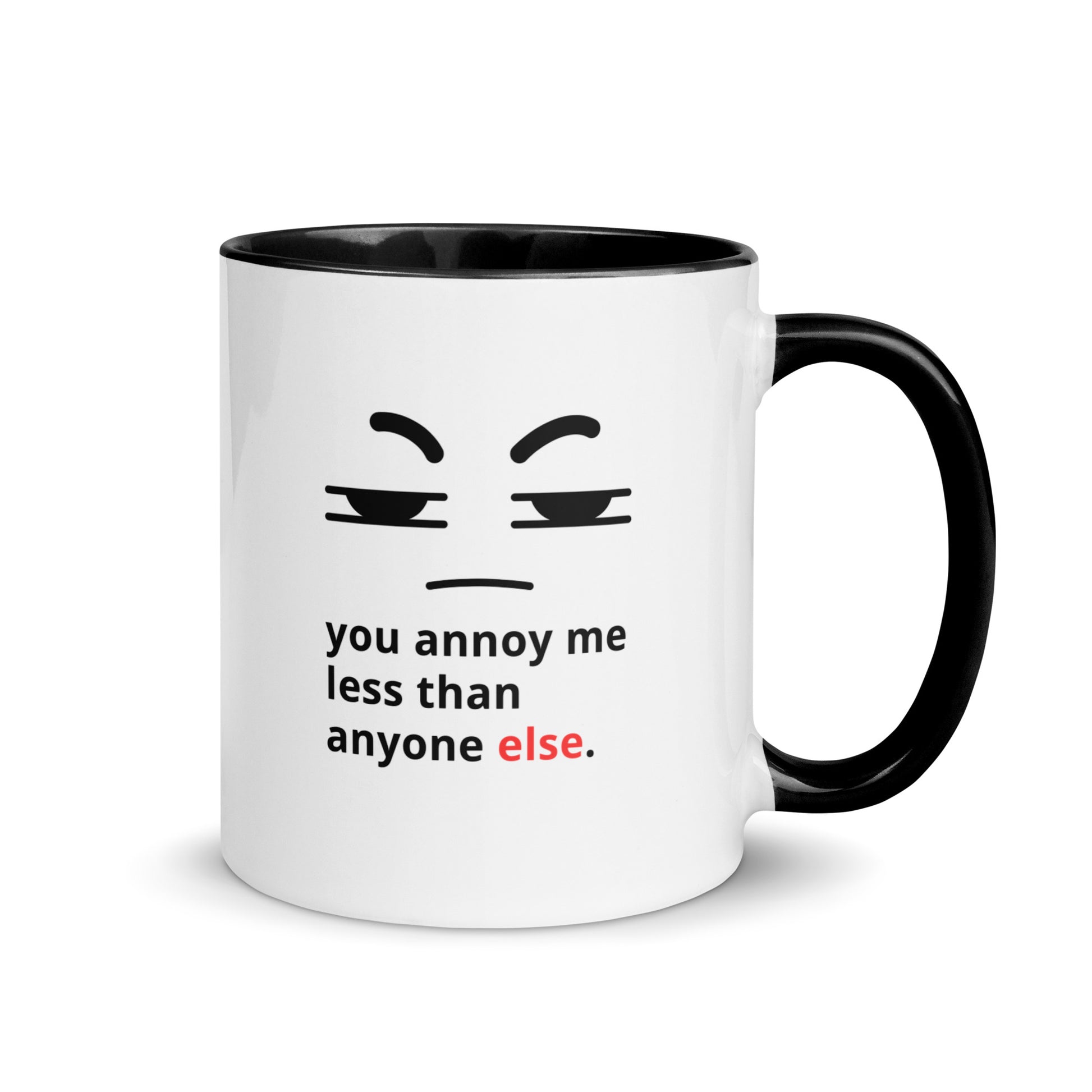 Snarky relationship mug with “You Annoy Me Less Than Anyone Else” text and frowning face design black handle and inside 